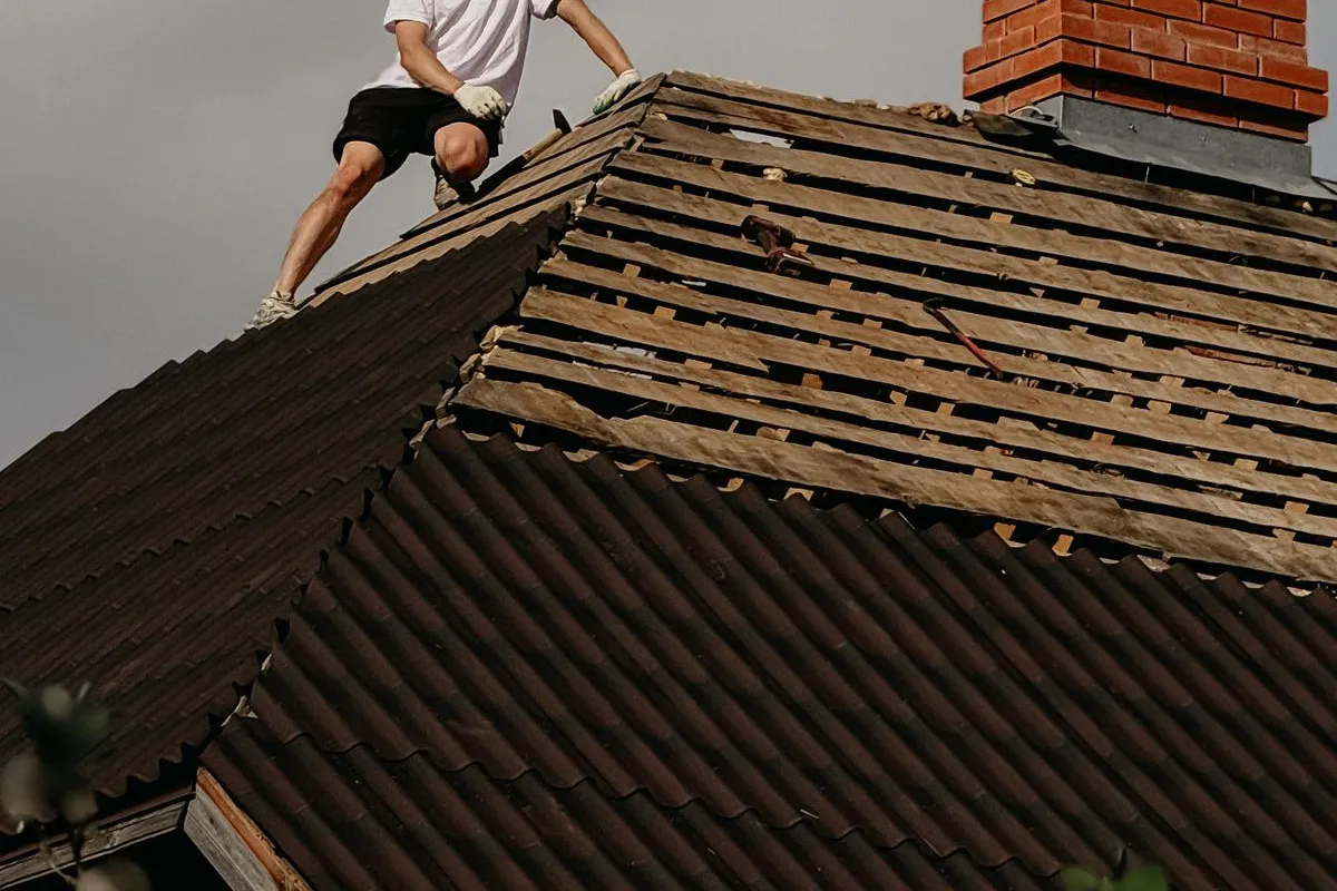 Roofing professional working on a residential roof.